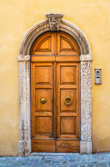 Fototapeta na wymiar Typical italian facade with door. Italian house.