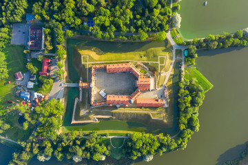 Nesvizh Castle is a residential castle of the Radziwill family in Nesvizh, Belarus, beautiful view in the summer against the blue sky.