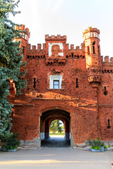 Outside facade of the Kholm Gate and swing bridge in the Brest Fortress at summer morning, Belarus.