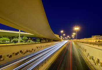 Beautiful light trails of fast-moving traffic at the blue hour in Bahrain