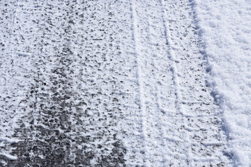 Fototapeta na wymiar Patterns of winter tires on ice