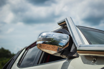 Fototapeta premium Vehicle snorkel and side mirrors on off-road vehicles, Side mirror turning lights.