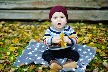 Cute newborn baby in warm wool knitted hat and sweater