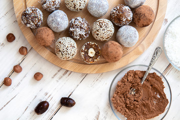 Cooking energy balls on a white background with ingredients