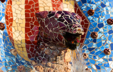 dragon head Mosaic Tiles Park Guell in Barcelona, Spain.