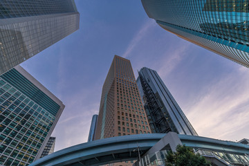 Fototapeta na wymiar Street level view of skyscraper buildings in Tokyo near Higashi-Shimbashi and Shiodome Area