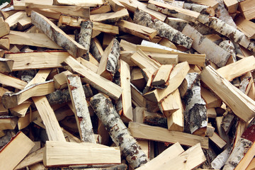 split birch wood, background of logs.
