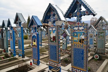 Merry Cemetery in Sapanta, Maramures County - Romania. Mar.12.2016. The cemetery is famous for the crosses of brightly colored tombs and naive paintings representing scenes from the lives of strangers