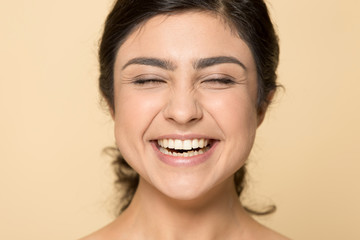 Happy indian girl laugh showing white healthy teeth