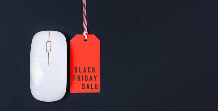 Online shopping Black friday sale text on red tag label and white mouse - Powered by Adobe