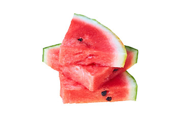 Heap of three pieces of fresh watermelon in form of triangle with red ripe juicy pulp and seeds isolated on white background without shadow