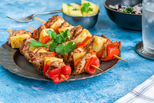 Jerk-style chicken and pineapple skewers with black bean rice
