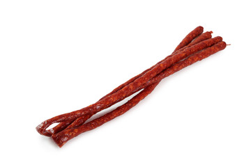 Kabanos. Polish long thin dry sausage made of pork. Isolated on white background.