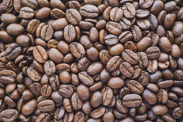 a lot of coffee beans medium roasted - food background