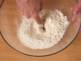 Make a well in the centre of the flour. Making Puff Pastry Series.