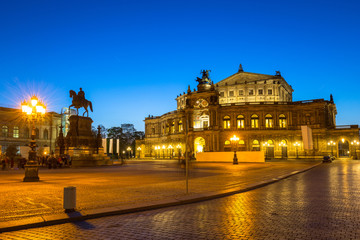 Fototapeta na wymiar Semperoper Opera and King John of Saxony monument at dusk, Dresden. Germany