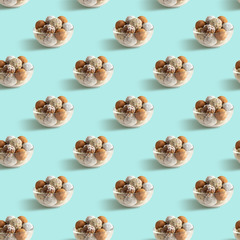 Energy balls seamless pattern on blue background.