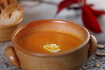 Pumpkin cream soup in a ceramic dish