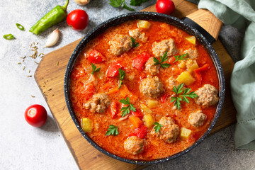 Spanish and Mexican food - Albondigas. Hot stew tomato soup with meatballs and vegetables.