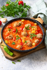 Spanish and Mexican food - Albondigas. Hot stew tomato soup with meatballs and vegetables. Free space for your text.