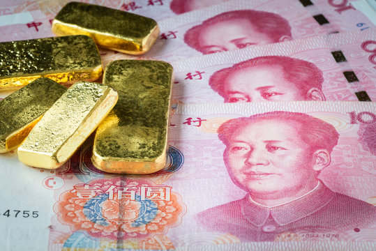 Stacked of gold bar on china banknote, CHY or Yuan with gold bar