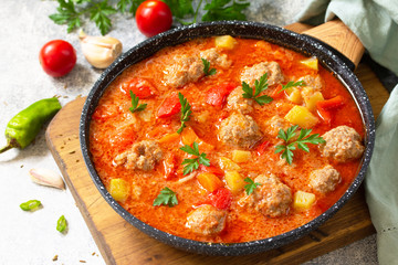 Spanish and Mexican food - Albondigas. Hot stew tomato soup with meatballs and vegetables.