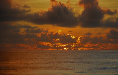 Hidden Sun behind clouds, at dawn