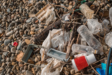 Garbage plastics on the rock beach