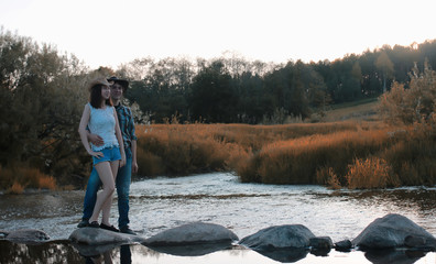 Obraz premium man and a girl are walking in the autumn