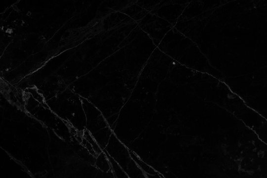 Black marble surface texture tile background.