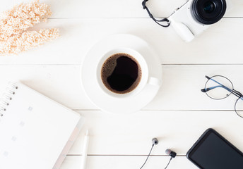 top view of office desk table with coffee cup and notebook on white background, graphic designer, Creative Designer concept.