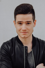 Obraz premium Portrait Of Young Handsome Man Smiling Outdoor