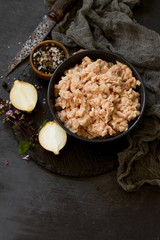 Minced meat and ingredients for cooking minced meat in a bowl on a slate. Free space for your text.