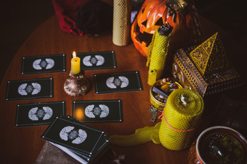  Mystical atmosphere, view of tarot card on the table, esoteric concept, fortune telling and predictions. 