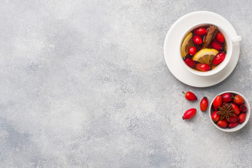 Drink from wild rose berries with lemon and honey cinnamon. Vitamin useful decoction of rose hips. Copy space