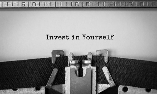 Text Invest in Yourself typed on retro typewriter