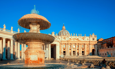 St. Peter's Basilica in Rome. Fountain of St. Peter's Square by Gian Lorenzo Bernini. Rome architecture and landmark. Italian Renaissance church. - obrazy, fototapety, plakaty