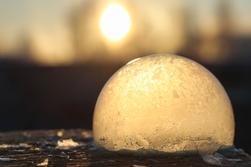 Soap bubbles freeze in the cold. Winter soapy water freezes in the air.