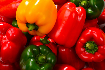 Fresh red, green, yellow bell pepper background.