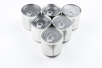 Group of silver canned food on white background.