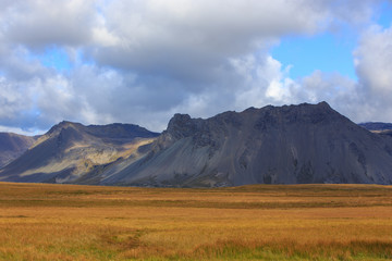 grassland and volcanic terrain