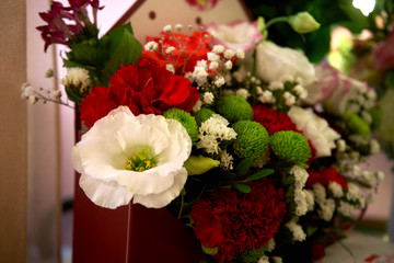 A beautiful bouquet of flowers is standing on the table. Presented for the holiday