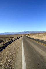 Fototapeta na wymiar The long hot road in the death valley national park