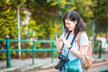 Asian women with camera Traveling in Macau.