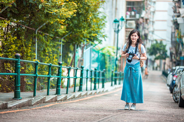 Fototapeta premium Asian women with camera Traveling in Macau.