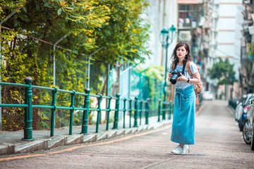 Naklejka premium Asian women with camera Traveling in Macau.