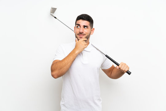 Handsome young golfer player man over isolated white background thinking an idea