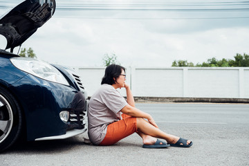 Woman unhappy and dismal from car engine problem