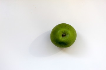 green apple on white background macro