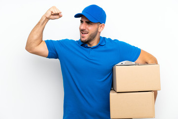 Delivery man over isolated white background celebrating a victory